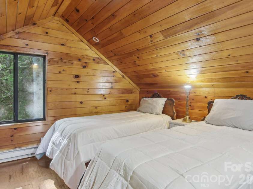 291 Dills Road, Bryson City, NC 28713.  MLS# CAR4373861, YatesRealty ID 19857. Loft sleeping area