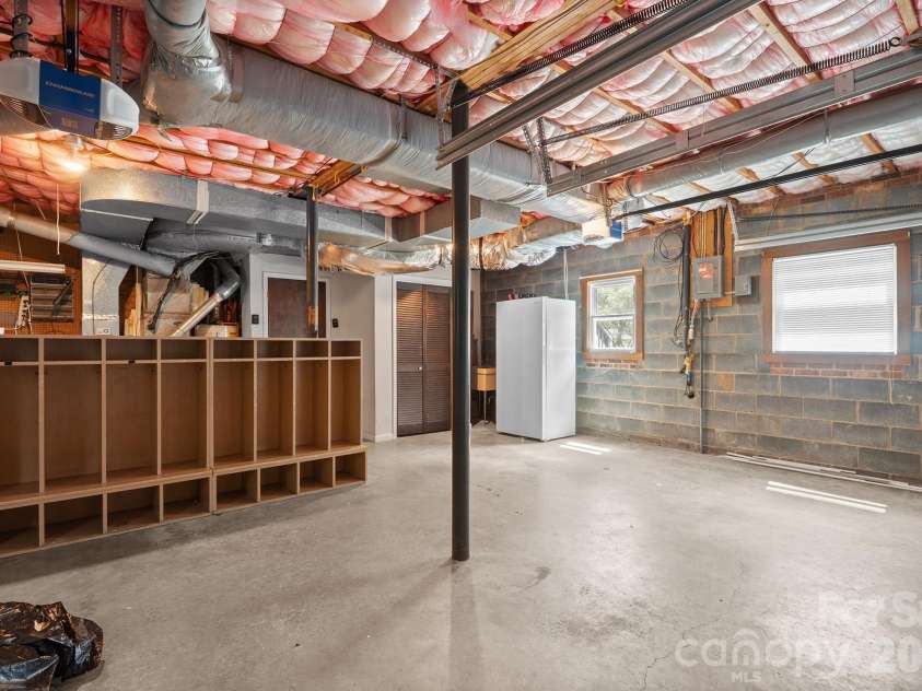 2310 24th Avenue, Hickory, NC 28601.  MLS# CAR4293562, YatesRealty ID 1986. Large garage with 2 new garage doors & workshop & storage areas