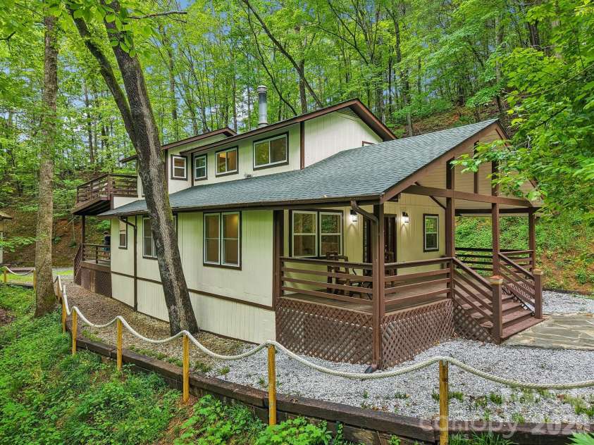 295/291 Dills Road, Bryson City, NC 28713.  MLS# CAR4373876, YatesRealty ID 19860. 291 Dills Road with peaceful covered deck