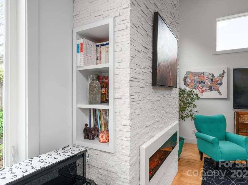 77 5th Avenue, Asheville, NC 28806.  MLS# CAR4257999, YatesRealty ID 19862. Built-ins on each side of fireplace