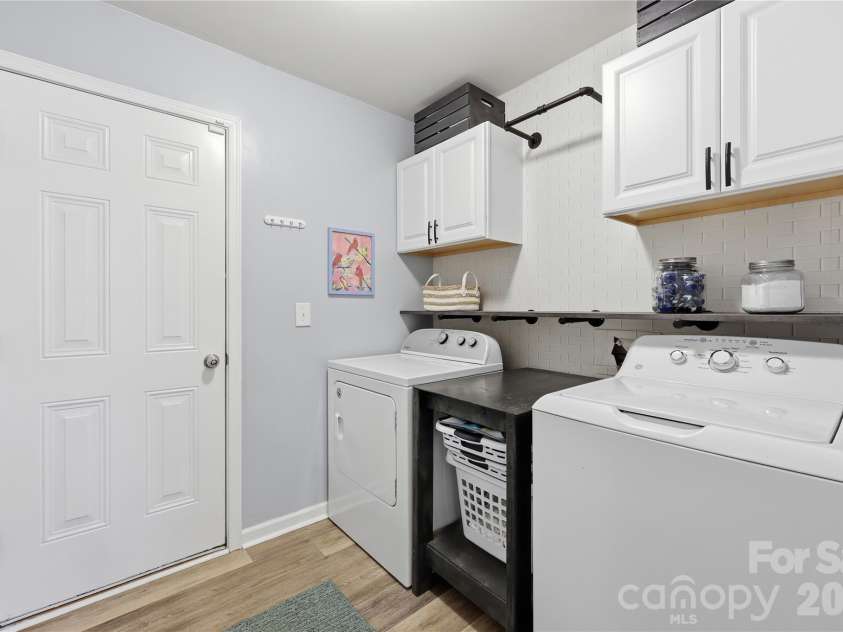 7135 Meyer Road, Fort Mill, SC 29715.  MLS# CAR4377464, YatesRealty ID 19864. Laundry room with storage. Enter from the garage.