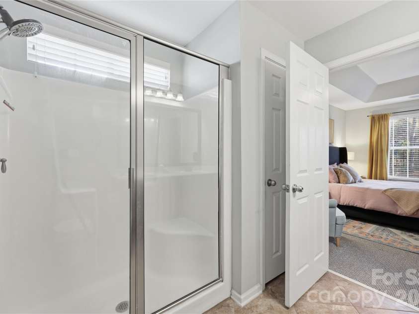 7135 Meyer Road, Fort Mill, SC 29715.  MLS# CAR4377464, YatesRealty ID 19864. Tiled shower and linen closet