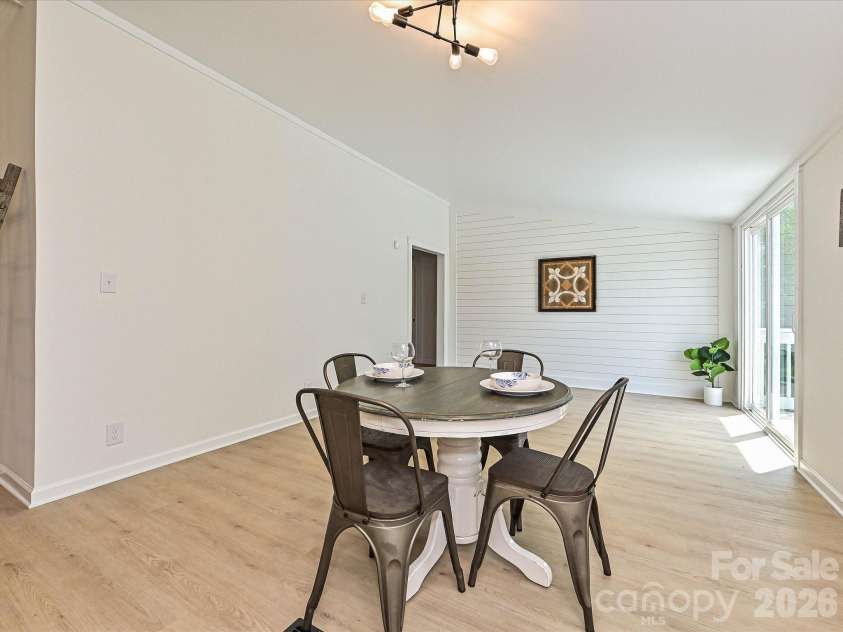 4076 Ritchfield Drive, Lincolnton, NC 28092.  MLS# CAR4376979, YatesRealty ID 19865. Huge oversized living or dining room.  Setup here with a round breakfast nook type of dining table but would be great with a large rectangular dining room table for a large family.  Note the new patio sliding door o