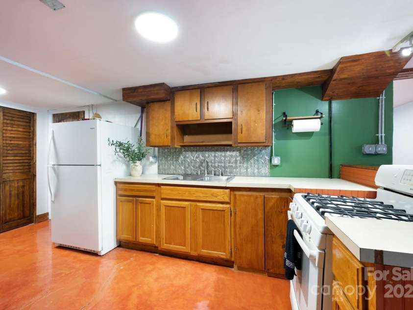 41 Michigan Avenue, Asheville, NC 28806.  MLS# CAR4263731, YatesRealty ID 19868. Basement Kitchen