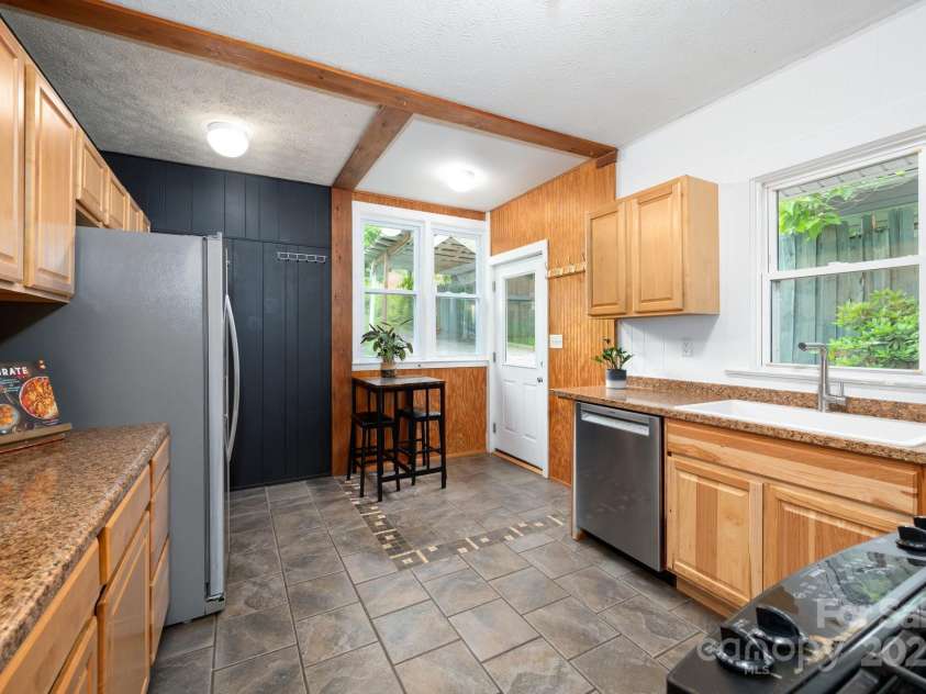 41 Michigan Avenue, Asheville, NC 28806.  MLS# CAR4263731, YatesRealty ID 19868. Large Kitchen with Rear Access to Patio