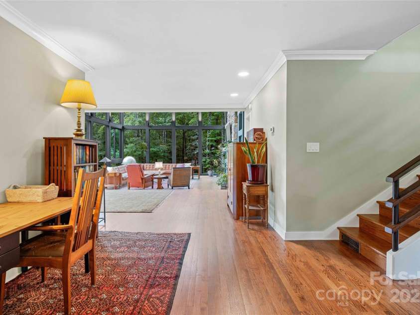 400 Kings Drive, Lake Lure, NC 28746.  MLS# CAR4264882, YatesRealty ID 19869. Beautifully refinished hardwood floors flow through the house into the wood staircase with modern 40's all wood banister