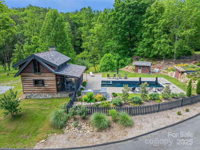 400 Kings Drive, Lake Lure, NC 28746.  MLS# CAR4264882, YatesRealty ID 19869. Circa 1860 Cabin Pool and Spa area with extended screened porch.