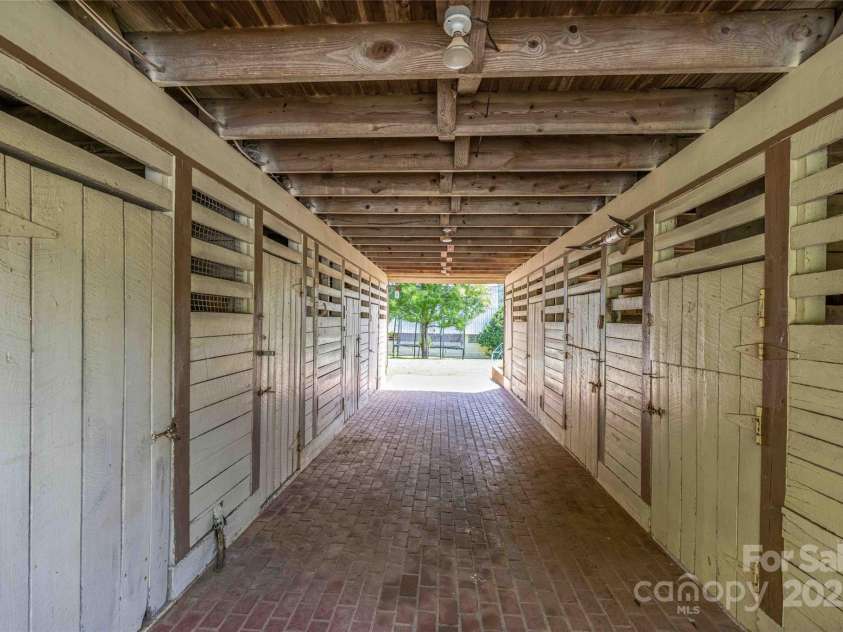 400 Kings Drive, Lake Lure, NC 28746.  MLS# CAR4264882, YatesRealty ID 19869. Stalls and Milking area with Hay Barn Above