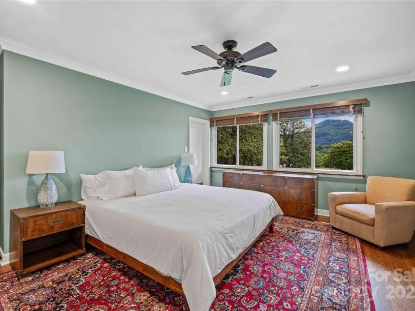 400 Kings Drive, Lake Lure, NC 28746.  MLS# CAR4264882, YatesRealty ID 19869. Upper level primary suite with East facing views and large closet and private bath.