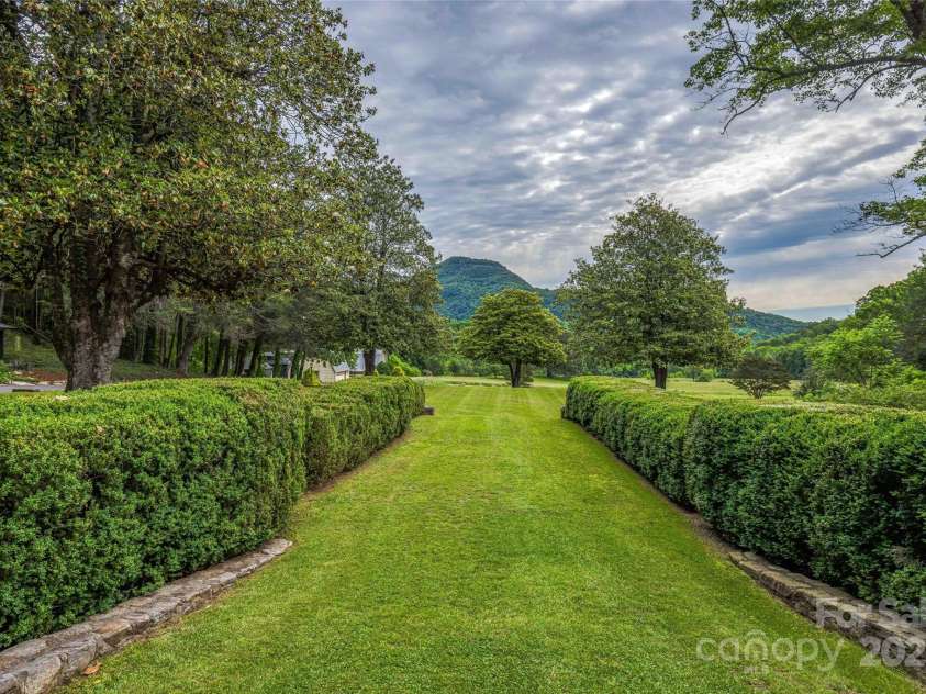 400 Kings Drive, Lake Lure, NC 28746.  MLS# CAR4329275, YatesRealty ID 19869. East facing gardens with sunrise views of Youngs Mountain
