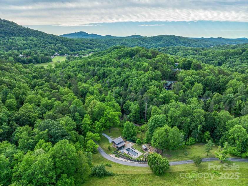 400 Kings Drive, Lake Lure, NC 28746.  MLS# CAR4329275, YatesRealty ID 19869. Looking at the entry of the Estate with Rumbling Bald golf greens in the distance. 