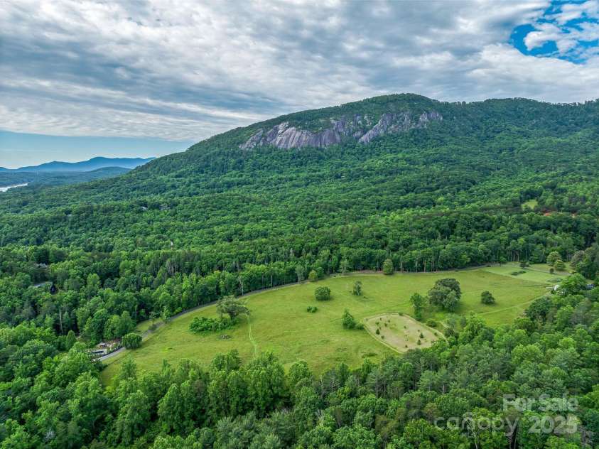 400 Kings Drive, Lake Lure, NC 28746.  MLS# CAR4329275, YatesRealty ID 19869. Over 30 acres of level Creekside pasture area that does not lay in a flood zone. 