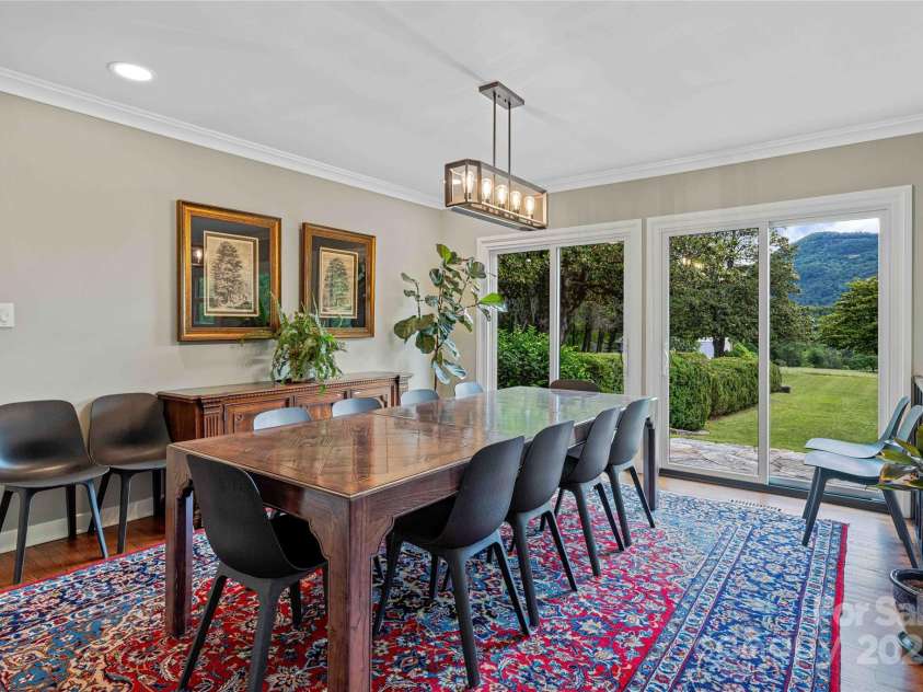 400 Kings Drive, Lake Lure, NC 28746.  MLS# CAR4329275, YatesRealty ID 19869. The expansive dining room area seats 12 or more guests