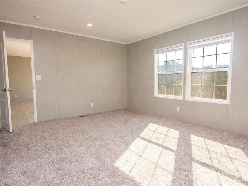 36 Whisper Mountain Road, Hendersonville, NC 28792.  MLS# CAR4373855, YatesRealty ID 19872. Primary BR w/ Mountain Views