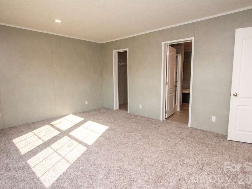 36 Whisper Mountain Road, Hendersonville, NC 28792.  MLS# CAR4373855, YatesRealty ID 19872. Primary Suite w/ Walk-in Closet