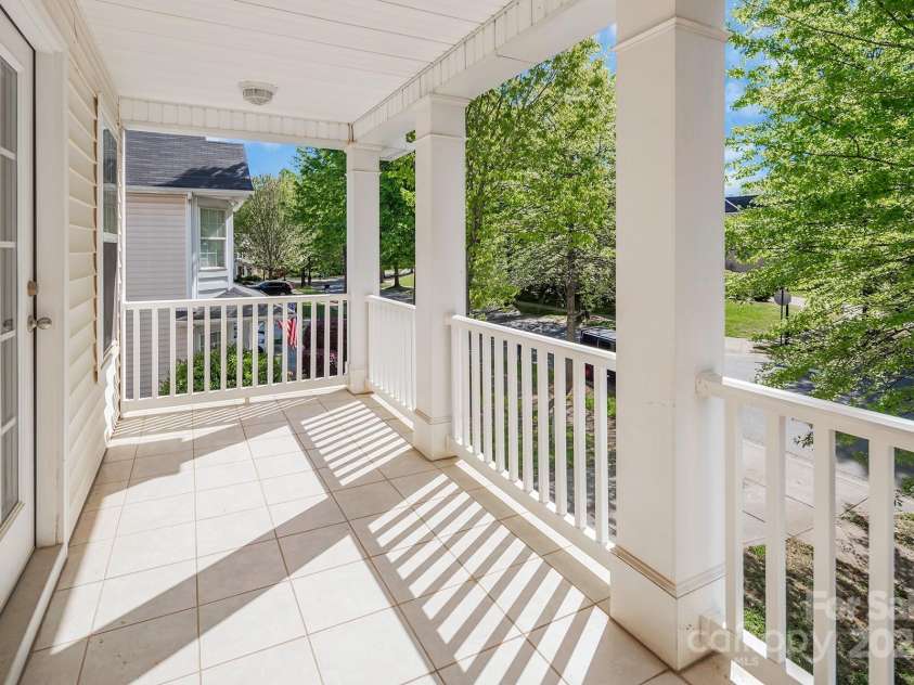 18023 Train Station Drive, Cornelius, NC 28031.  MLS# CAR4198417, YatesRealty ID 19875. 2nd Floor porch off the guest bedroom has a beautiful view of the neighborhood.