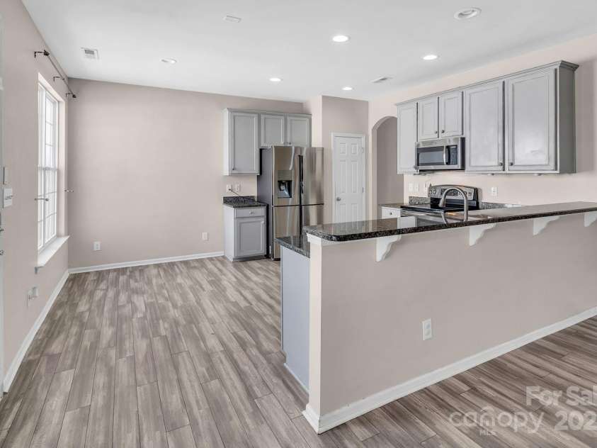18023 Train Station Drive, Cornelius, NC 28031.  MLS# CAR4198417, YatesRealty ID 19875. Great size kitchen with breakfast area and pantry- tons of cabinet space!