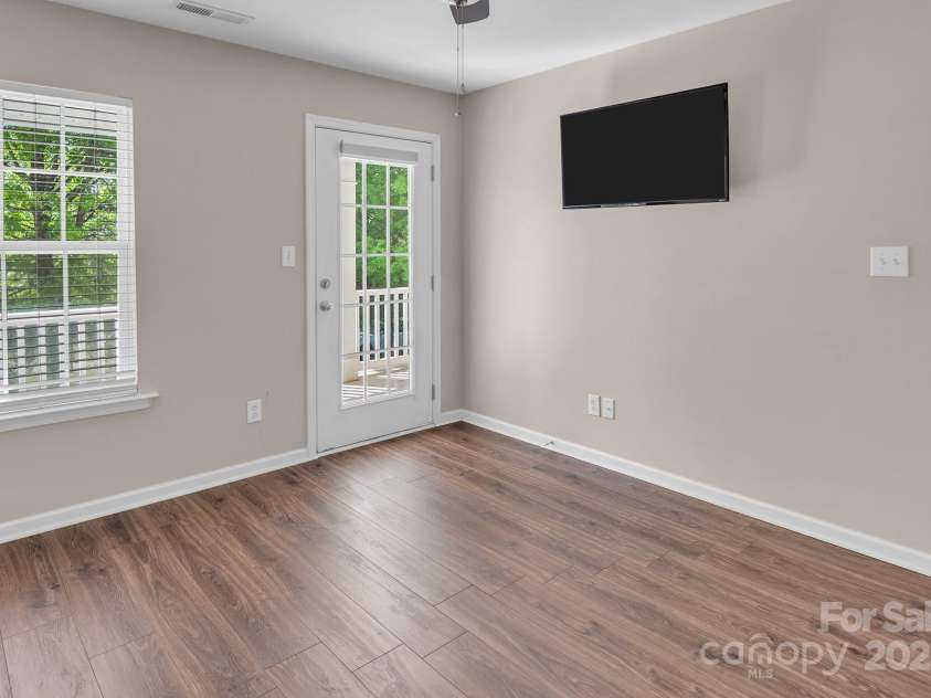 18023 Train Station Drive, Cornelius, NC 28031.  MLS# CAR4198417, YatesRealty ID 19875. Guest Bedroom with walk-out 2nd level porch.