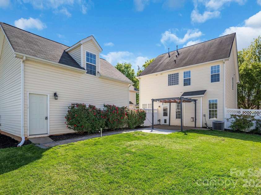 18023 Train Station Drive, Cornelius, NC 28031.  MLS# CAR4198417, YatesRealty ID 19875. Large backyard with detached garage and second living quarters