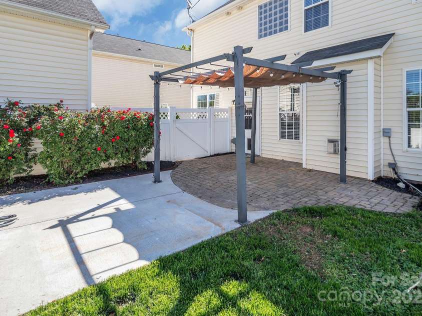 18023 Train Station Drive, Cornelius, NC 28031.  MLS# CAR4198417, YatesRealty ID 19875. Perfect size patio for hosting a BBQ or just relaxing with a cup of coffee in the morning.