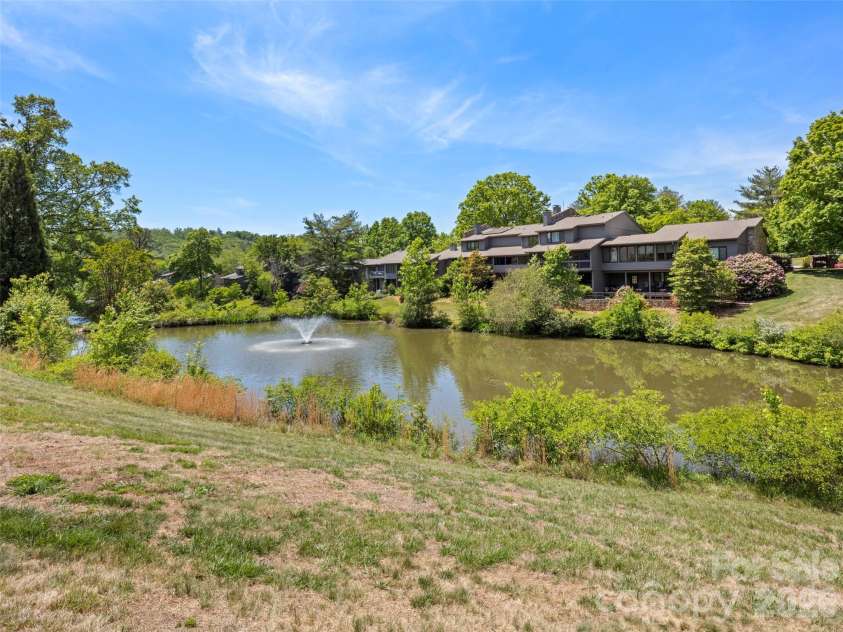 203 Crowfields Drive, Asheville, NC 28803.  MLS# CAR4378938, YatesRealty ID 19877. Community ponds