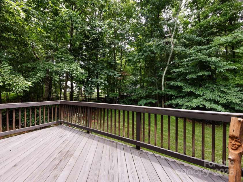 1423 Piper Court, Concord, NC 28025.  MLS# CAR4269356, YatesRealty ID 19879. Nicely sized deck overlooking backyard