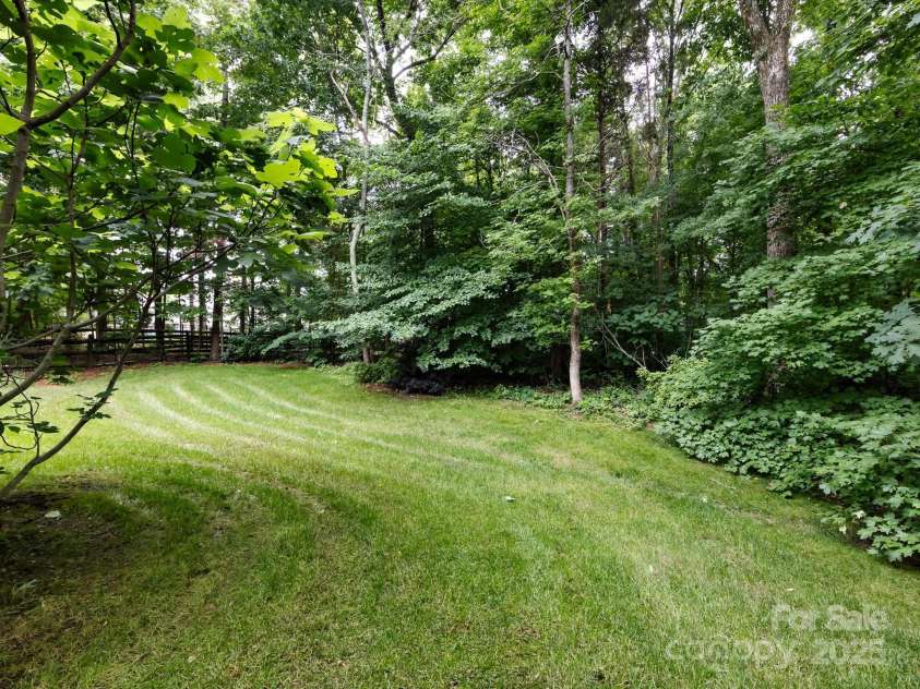1423 Piper Court, Concord, NC 28025.  MLS# CAR4269356, YatesRealty ID 19879. Private treelined backyard