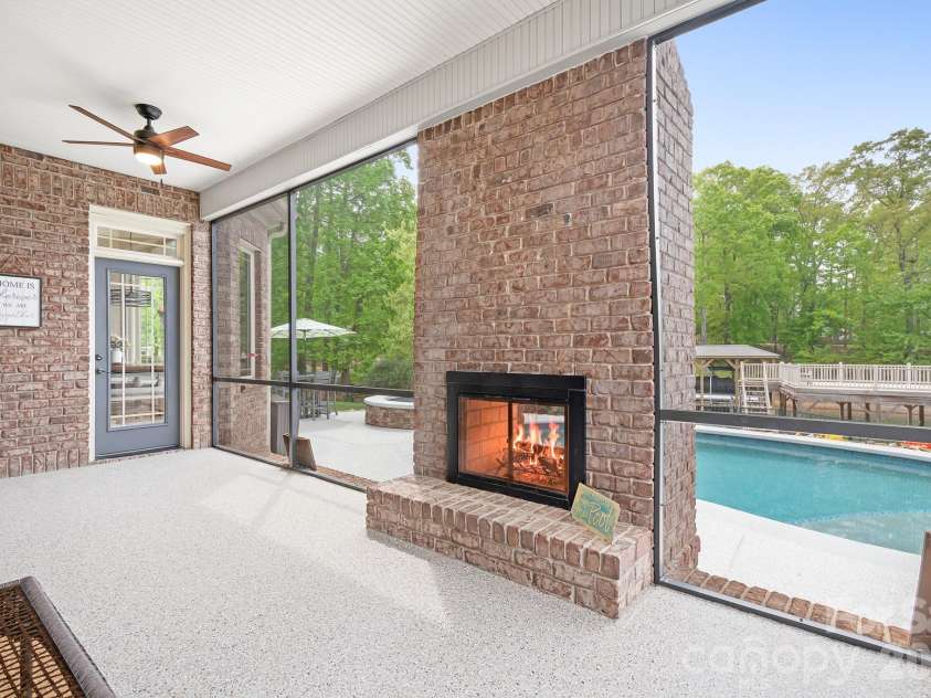 1395 Strawberry Lane, Denver, NC 28037.  MLS# CAR4370070, YatesRealty ID 19880. Fireplace is see through to the poolside!