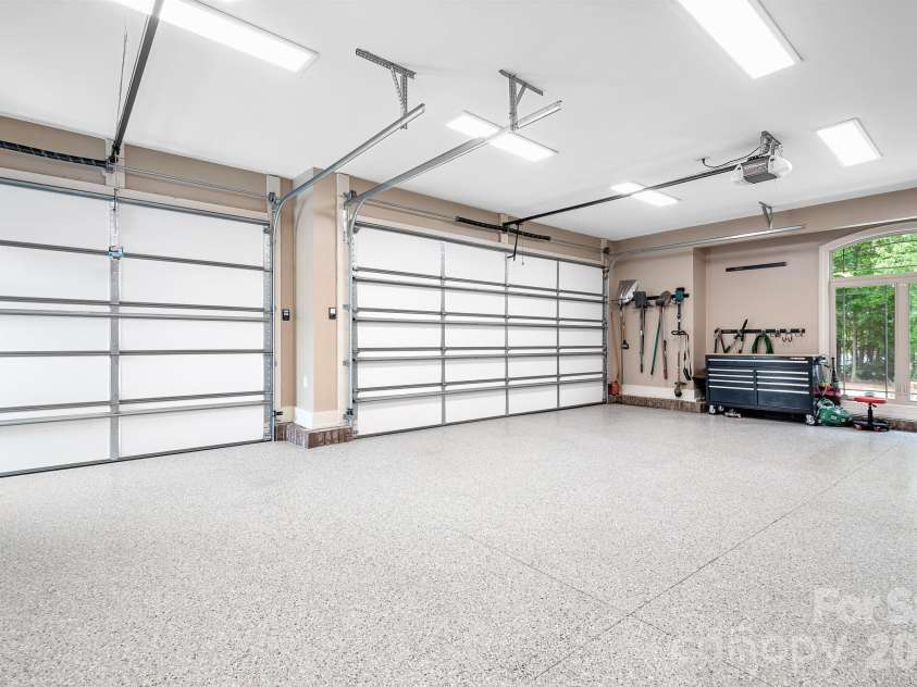 1395 Strawberry Lane, Denver, NC 28037.  MLS# CAR4370070, YatesRealty ID 19880. Immaculate 3 car garage with epoxied floor.  Extra storage closet here. 