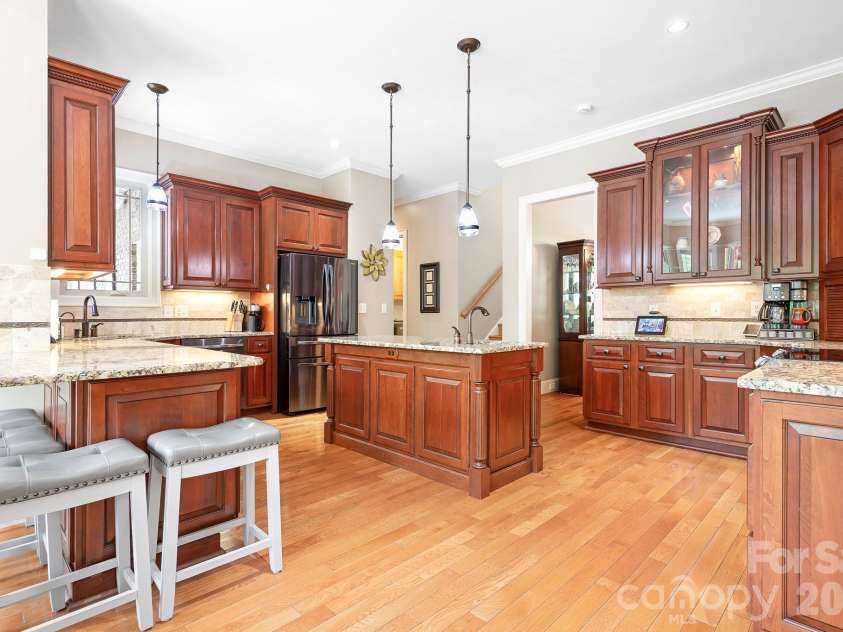 1395 Strawberry Lane, Denver, NC 28037.  MLS# CAR4370070, YatesRealty ID 19880. What a stunning kitchen. Extra seating under extended countertop.  