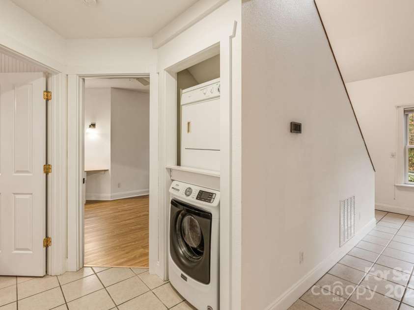 19 Castle Street, Asheville, NC 28803.  MLS# CAR4250790, YatesRealty ID 19881. Main house laundry in hall