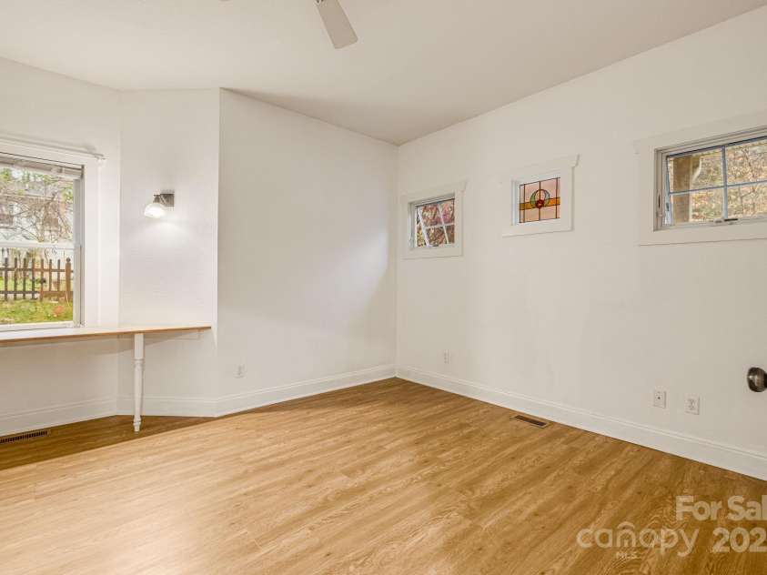 19 Castle Street, Asheville, NC 28803.  MLS# CAR4250790, YatesRealty ID 19881. Main house Main level bedroom