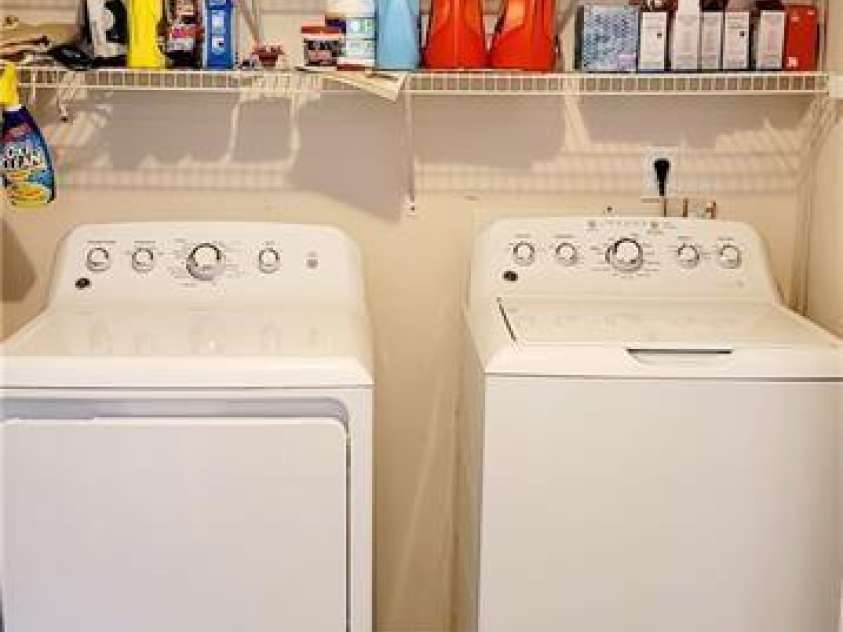 15404 Crossing Gate Drive, Cornelius, NC 28031.  MLS# CAR4363409, YatesRealty ID 19885. Laundry with shelving
