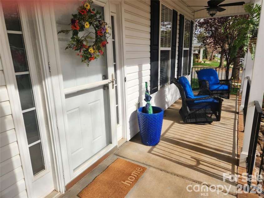15404 Crossing Gate Drive, Cornelius, NC 28031.  MLS# CAR4363409, YatesRealty ID 19885. Long front, covered porch for sunset views