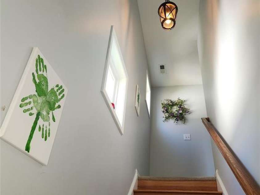 15404 Crossing Gate Drive, Cornelius, NC 28031.  MLS# CAR4363409, YatesRealty ID 19885. Wooden staircase
