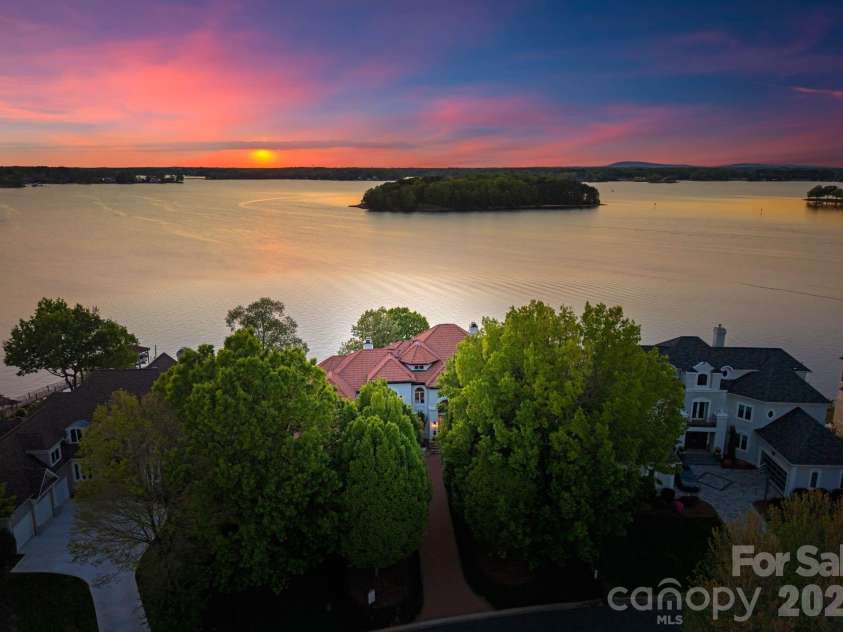18103 Harbor Light Boulevard, Cornelius, NC 28031.  MLS# CAR4361515, YatesRealty ID 19890. Breathtaking west-facing sunset views over Lake Norman from a premier main-channel setting