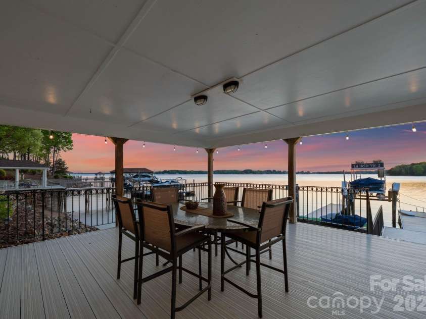 18103 Harbor Light Boulevard, Cornelius, NC 28031.  MLS# CAR4361515, YatesRealty ID 19890. Covered lakeside pavilion offers the perfect setting for sunset dining and entertaining just steps from the water