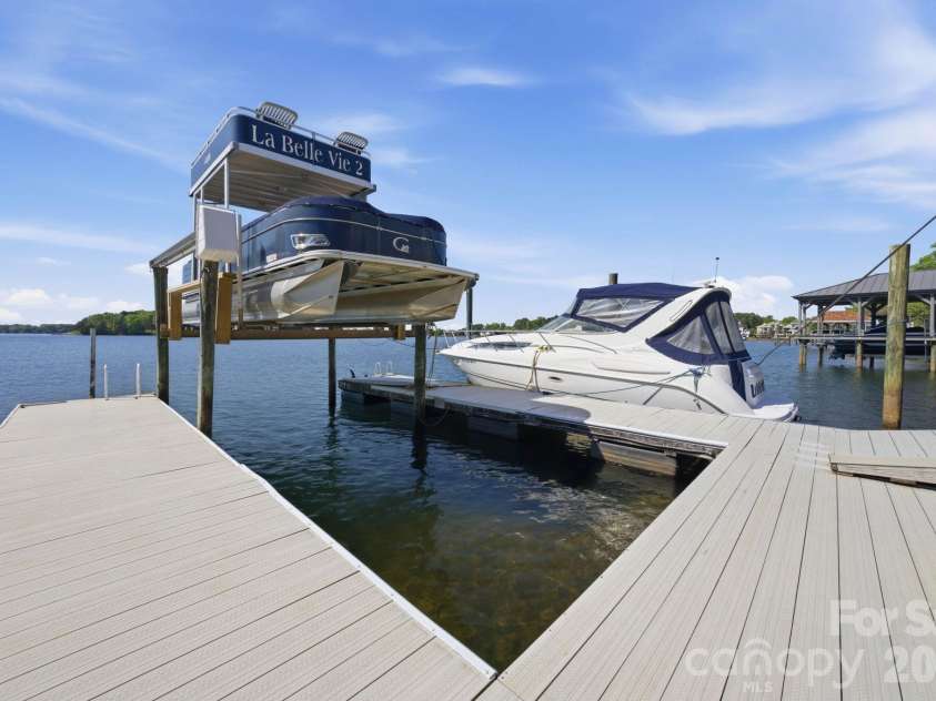 18103 Harbor Light Boulevard, Cornelius, NC 28031.  MLS# CAR4361515, YatesRealty ID 19890. Deep-water dock with boat slip, lift, and space for multiple watercrafts