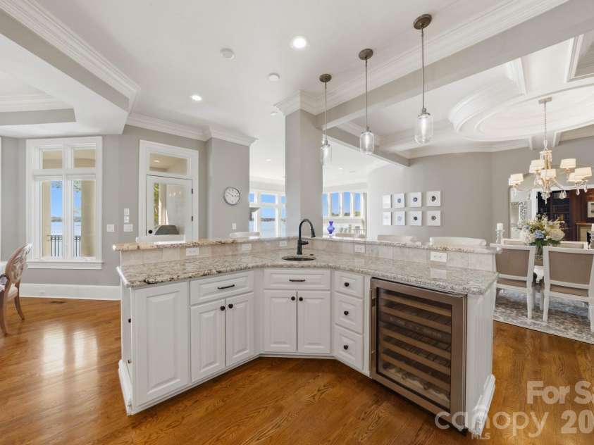 18103 Harbor Light Boulevard, Cornelius, NC 28031.  MLS# CAR4361515, YatesRealty ID 19890. Elegant wet bar with granite countertops and wine storage, ideal for entertaining