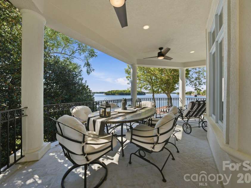 18103 Harbor Light Boulevard, Cornelius, NC 28031.  MLS# CAR4361515, YatesRealty ID 19890. Elevated wraparound terrace designed for outdoor dining with panoramic lake views