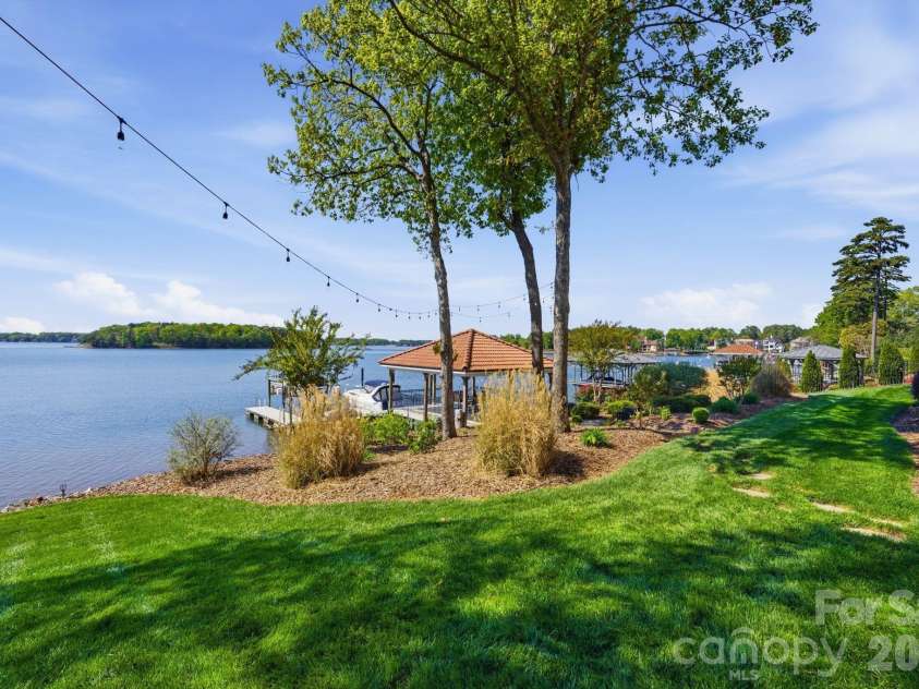 18103 Harbor Light Boulevard, Cornelius, NC 28031.  MLS# CAR4361515, YatesRealty ID 19890. Expansive lakeside grounds with gazebo and direct access to deep water.