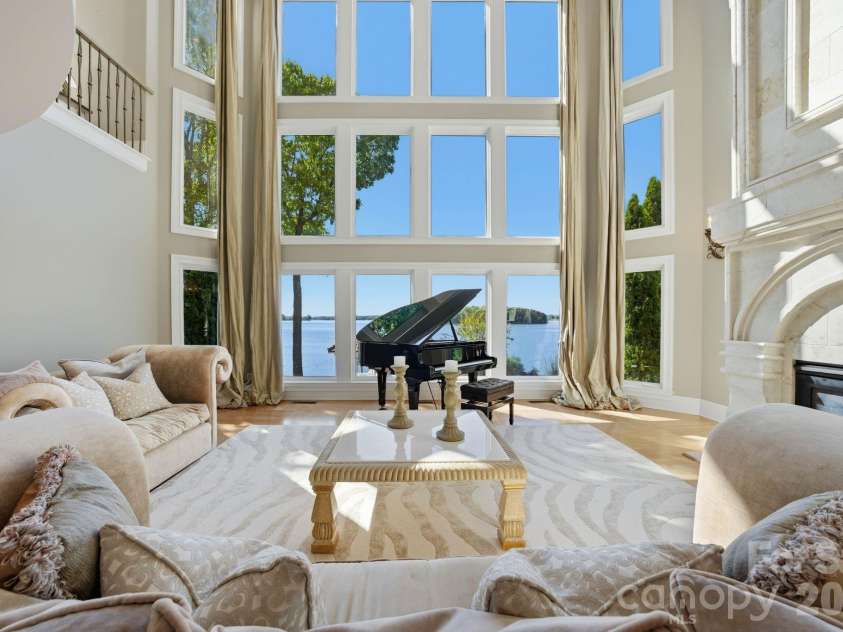 18103 Harbor Light Boulevard, Cornelius, NC 28031.  MLS# CAR4361515, YatesRealty ID 19890. Floor-to-ceiling windows capture breathtaking main channel views