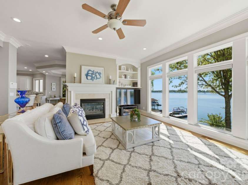 18103 Harbor Light Boulevard, Cornelius, NC 28031.  MLS# CAR4361515, YatesRealty ID 19890. Light-filled living space with expansive windows and lake views