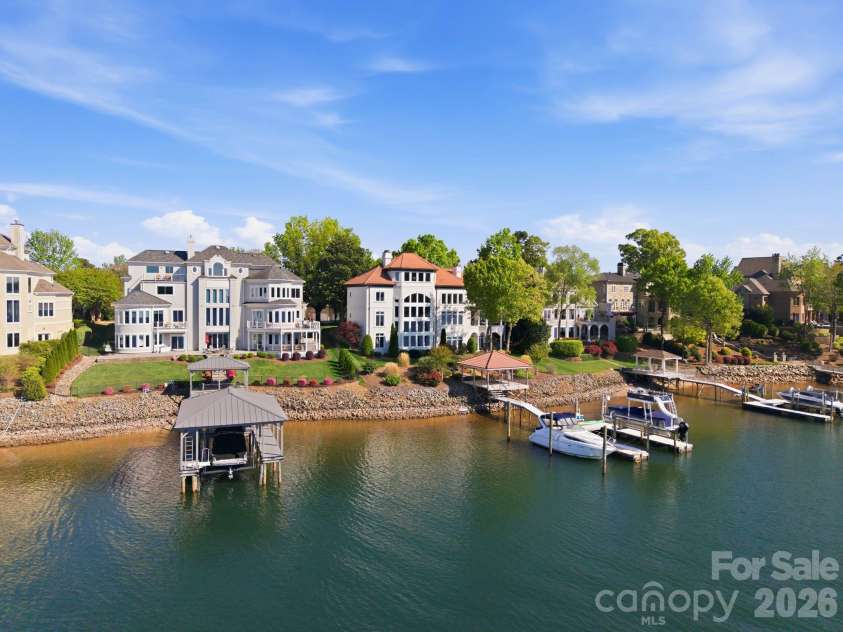 18103 Harbor Light Boulevard, Cornelius, NC 28031.  MLS# CAR4361515, YatesRealty ID 19890. Main channel waterfront estate with private dock and sweeping lake views