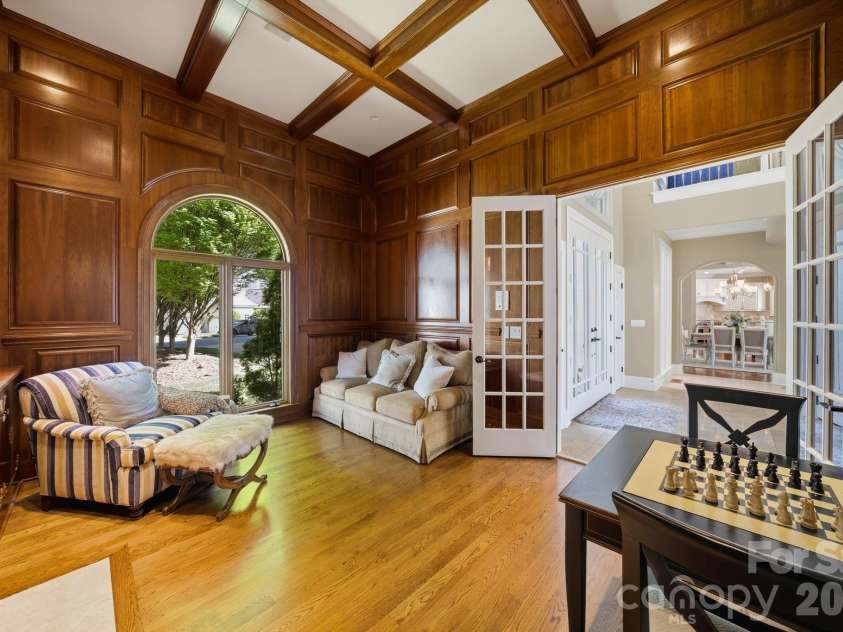 18103 Harbor Light Boulevard, Cornelius, NC 28031.  MLS# CAR4361515, YatesRealty ID 19890. Private study with coffered ceiling and custom built-ins