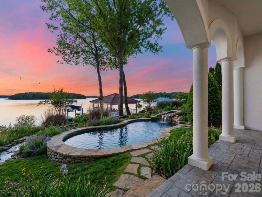 18103 Harbor Light Boulevard, Cornelius, NC 28031.  MLS# CAR4361515, YatesRealty ID 19890. Resort-style pool and spa overlooking the lake (virtual rendering), illustrating the exceptional outdoor living potential of the property