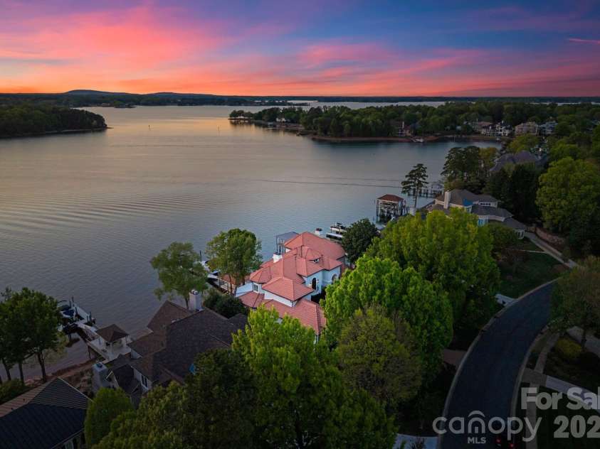 18103 Harbor Light Boulevard, Cornelius, NC 28031.  MLS# CAR4361515, YatesRealty ID 19890. Stunning waterfront residence ideally positioned to capture expansive lake views and evening sunsets