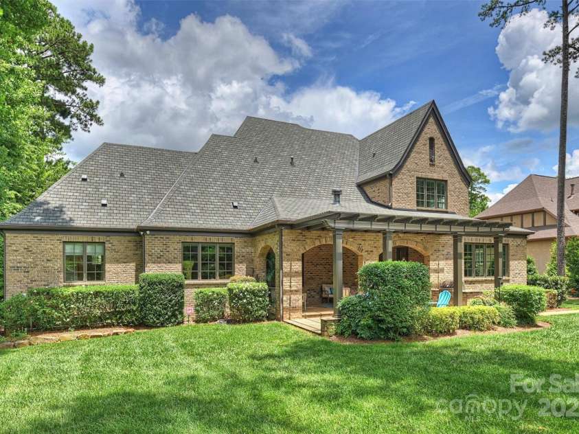 3032 Kings Manor Drive, Matthews, NC 28104.  MLS# CAR4265351, YatesRealty ID 19894. Rear view of home.