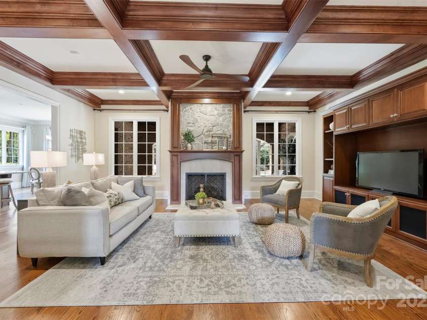 3032 Kings Manor Drive, Matthews, NC 28104.  MLS# CAR4265351, YatesRealty ID 19894. The Great Room looks out to the covered porch and backyard.