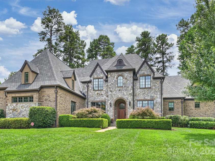 3032 Kings Manor Drive, Matthews, NC 28104.  MLS# CAR4265351, YatesRealty ID 19894. The master masonry on the exterior of the home is gorgeous.  This is a very sturdy, well built home with extra piers in the the encapsulated crawlspace.  The house also features a huge 23' x 12' walk in attic with sp